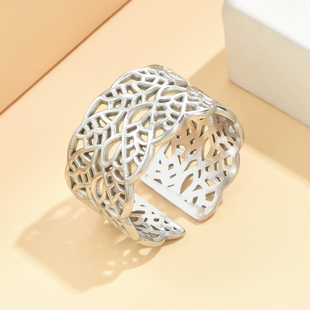 Elegant Hollowed Leaf Stainless Steel Ring: Artistic Retro Wide Band, Vacuum Gold Plated Jewelry for Women.