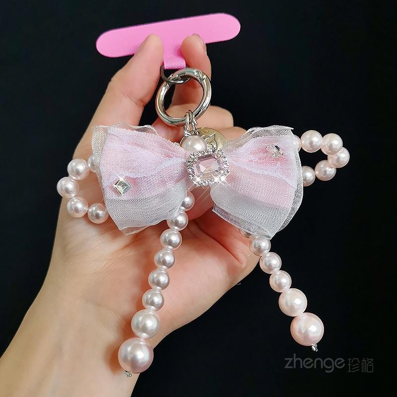 Mesh bow pearl bracelet women's ins fashion Xiaoxiangfeng mobile phone pendant mobile phone lanyard short wrist