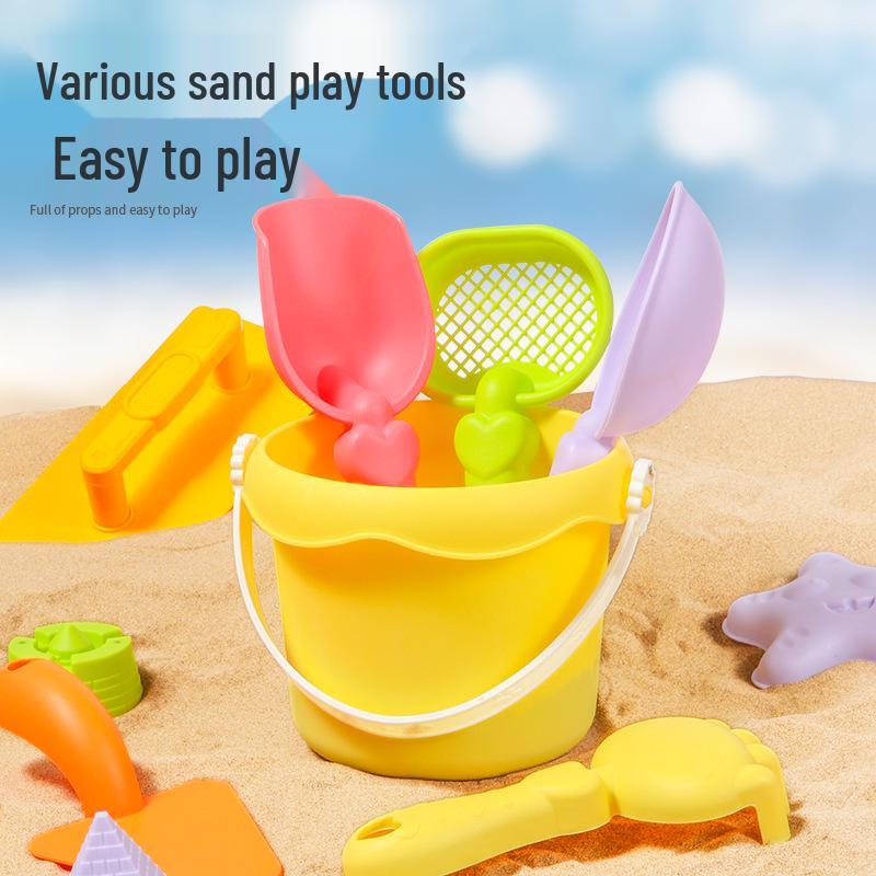 Complete Beach Toy Set: Includes Shovel, Wheelbarrow, Bucket, and Water Toys for Kids' Sand Play at the Seaside.
