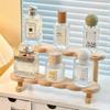This 3-layer perfume storage rack is made of wood and is suitable for storing and displaying items