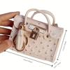 PU-Leder Münzbörse mit Quasten-Schlüsselanhänger Mini Straußenmuster Handtasche Tragbarer Lippenstift-Schlüsselhalter Modisches Schmuckstück Schlüsselbeutel