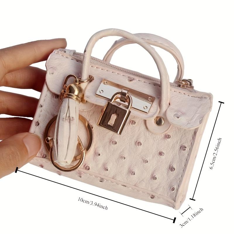 PU-Leder Münzbörse mit Quasten-Schlüsselanhänger Mini Straußenmuster Handtasche Tragbarer Lippenstift-Schlüsselhalter Modisches Schmuckstück Schlüsselbeutel