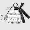 Trendy Musical Note Keyring Key Holder Featuring Piano Keys And Delicate Bowknot Perfect For Music Enthusiasts