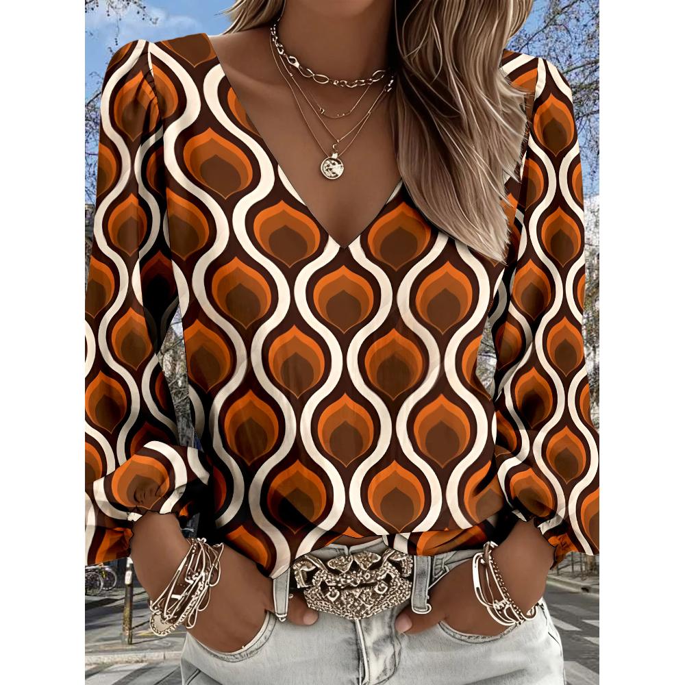 The new women's blouse features a printed V-neck long-sleeve design. It adopts Bohemian-style fringed sleeves and is perfect for spring.