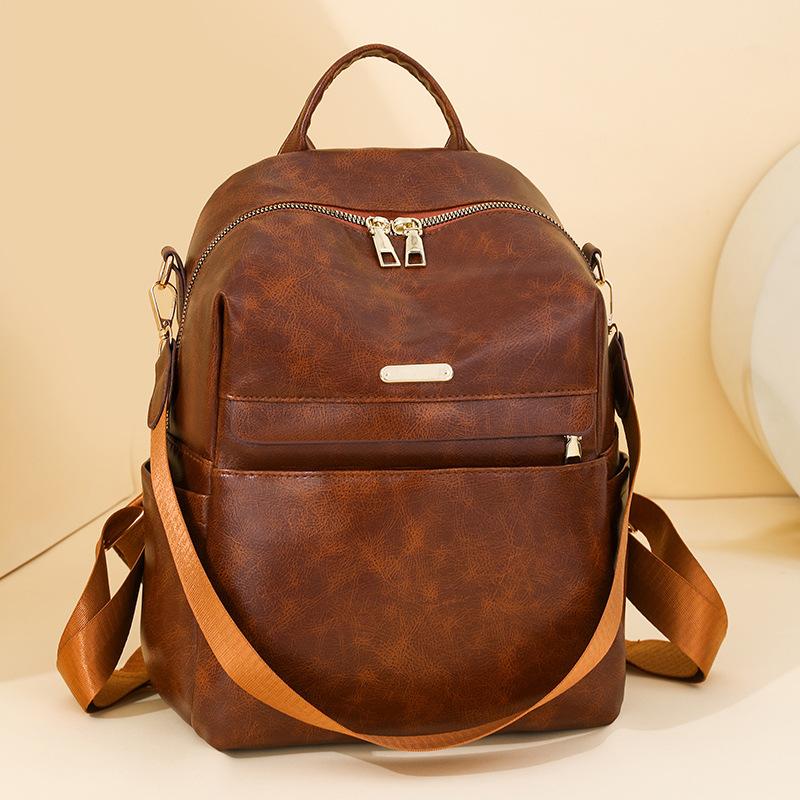 Retro soft leather backpack women's new fashion trend backpack student simple shoulder travel bag