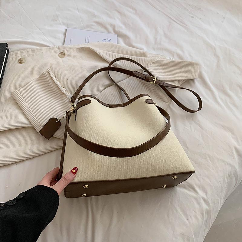 Vysoce kvalitní dámská crossbody taška Módní kontrastní barva Patchwork Velká kapacita Dámská plátěná taška ve tvaru kbelíku Klasická retro kabelka