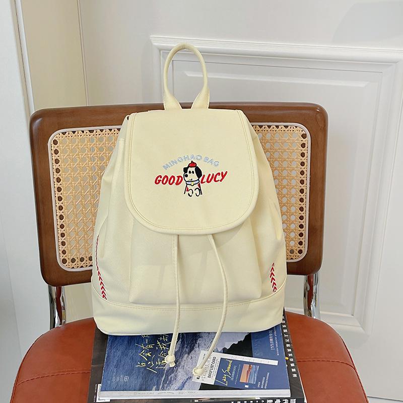 Japanese Student Casual Backpack with Embroidered Puppy Design, Drawstring Closure, and Matching Small Bag for Daily Use.