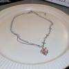 A Single-piece Pink, Understated Luxury Necklace for Women. Features a Minimalist Style with Diamond, Heart, and Star Patterns,