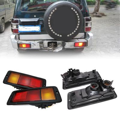 Riflettori Paraurti Posteriore Luce MB124963 MB124964 Per Pajero Montero 1992-99 Luci di Ingombro Paraurti Posteriore Lampade di Emergenza