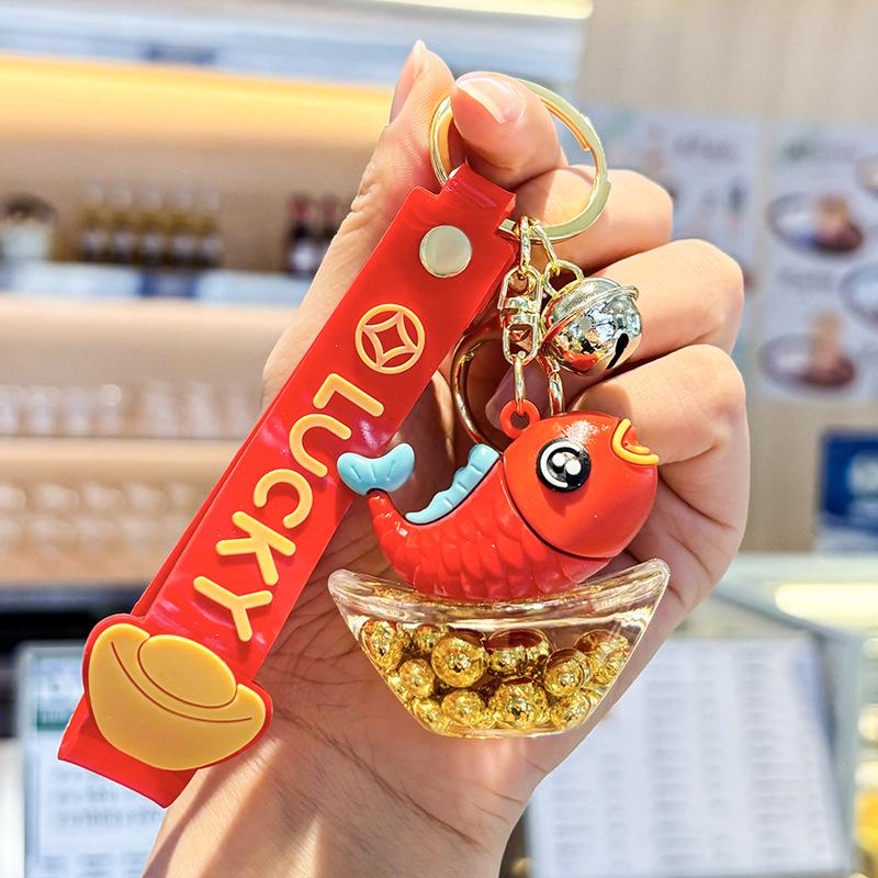 Akrylový přívěsek na klíče s tekutým pískem a obsahem oleje - Perfektní malý dárek na tašku nebo do auta.