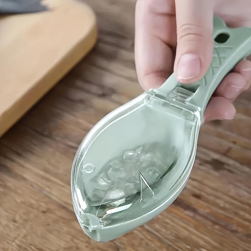 

Manual fish scale remover, PP plastic scraper, practical non-electric kitchen tool for quick fish cleaning.