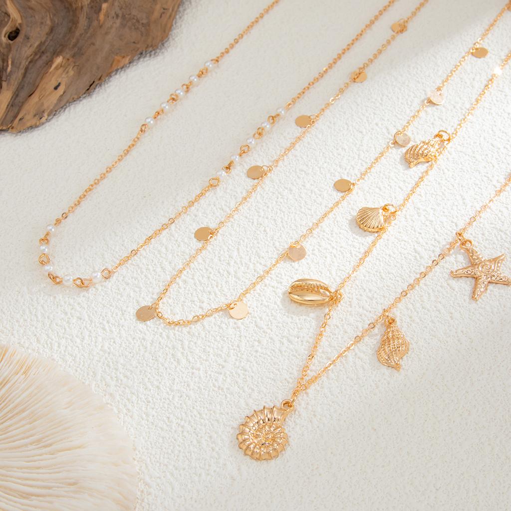 Mehrlagige Seestern Muschel Taillenkette Trendige Imitationsperle Sexy Bikini Goldfarbene Bauchkette für Frauen Mädchen Körperschmuck Geschenke