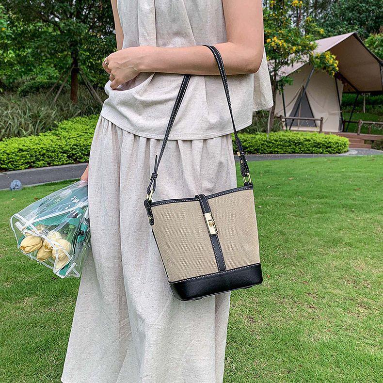 Cowhide canvas splicing bucket bag women's 2025 summer shoulder oblique span bag casual versatile underarm bag Korean version tide