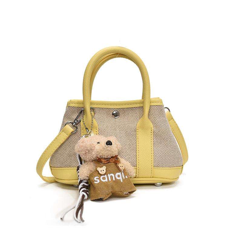 Korean version of casual niche contrasting color splicing portable bucket bag fashion versatile temperament casual commuter messenger bag woman