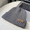 Coarse thread knitted hat children autumn and winter leather label letter wool hat big head circumference warm ear protection cold hat men