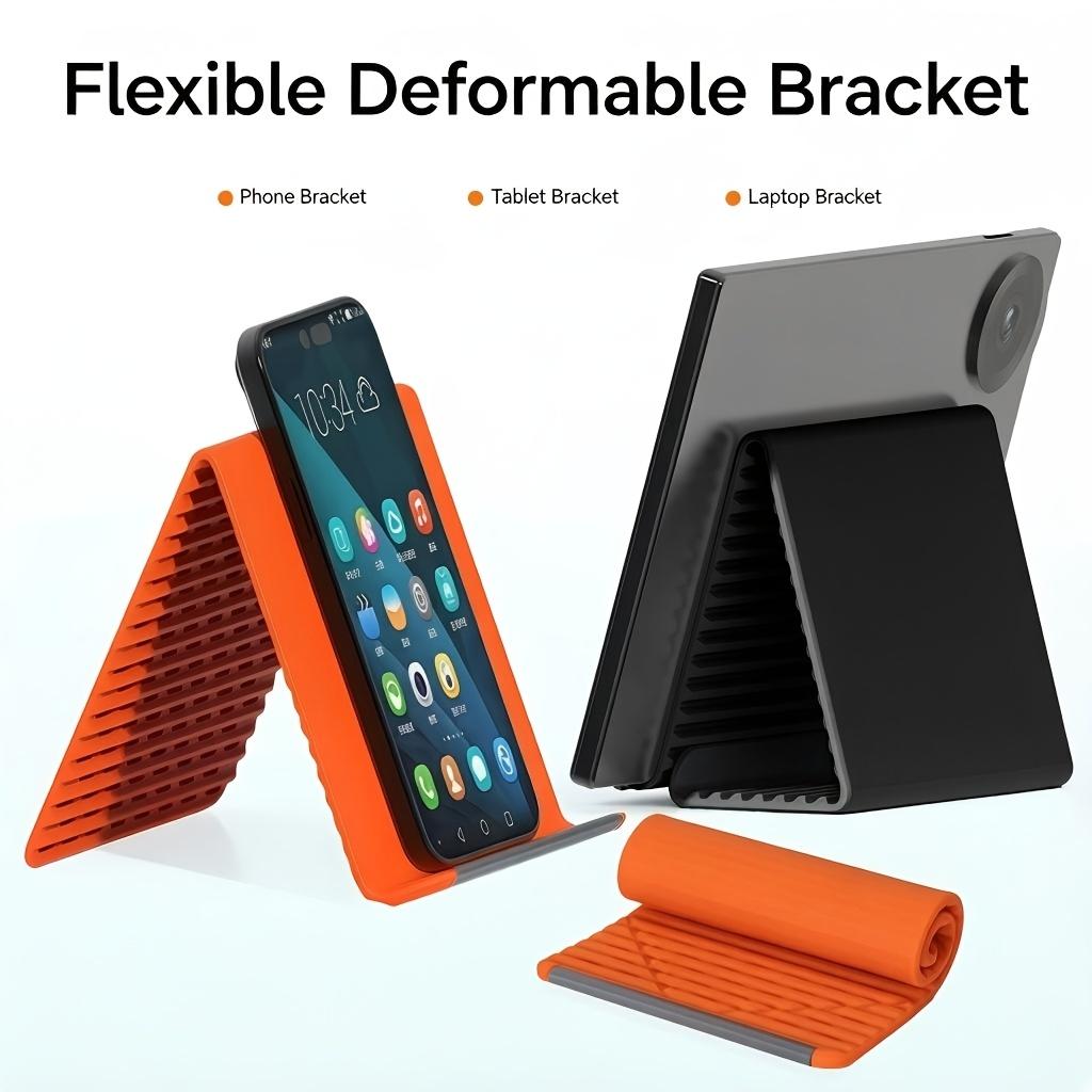 

A -new, transformable folding stand featuring an inner layer of aluminum and silicone for flexible support. оранжевый