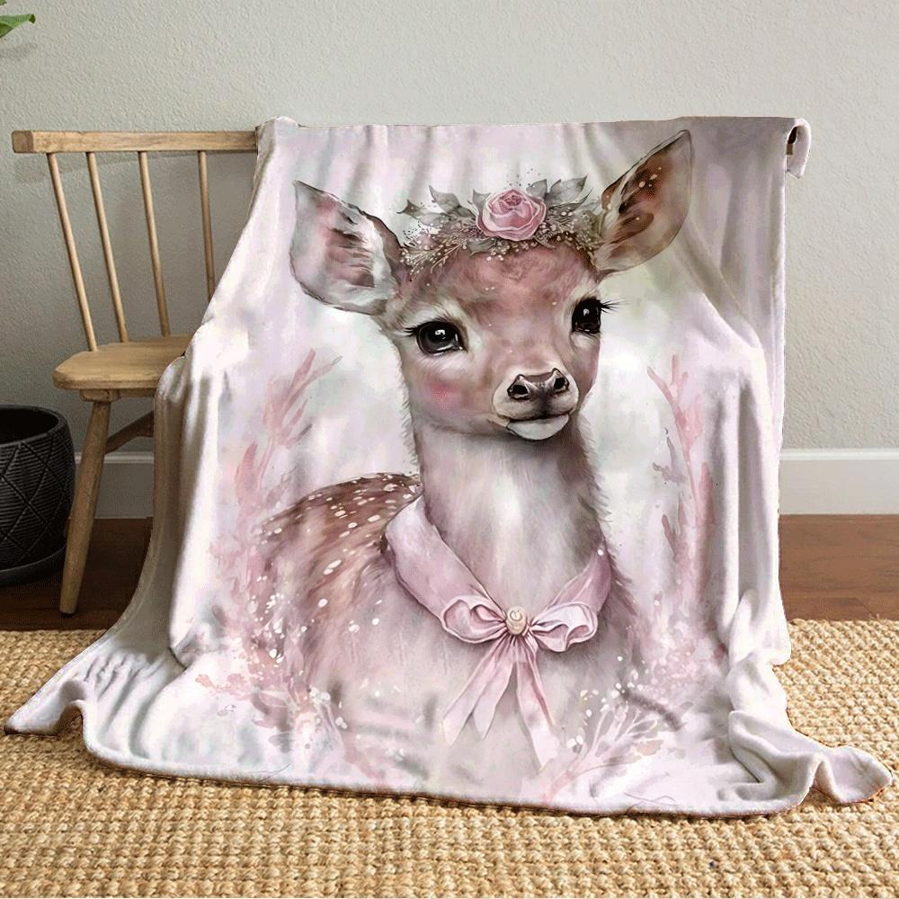 A delicate fawn adorned with a floral crown and pink ribbon on its neck. for all seasons blanket lunch break throw gift