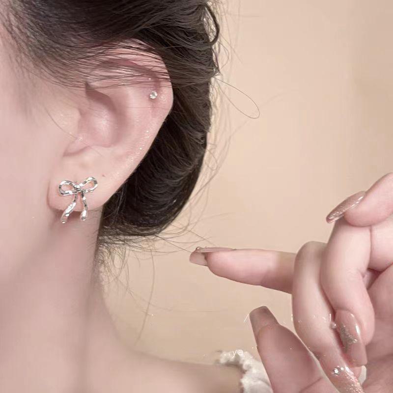 2025 Minimalist Silver Bow Earrings: Elegant, High-End, Unique Design for Women.