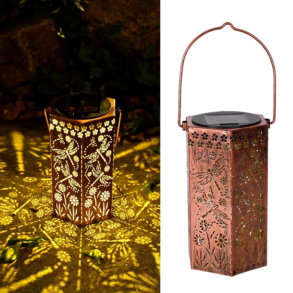 Outdoor Solar Wrought Iron Lantern: Waterproof Hollow Projection Table Lamp for Courtyard and Garden