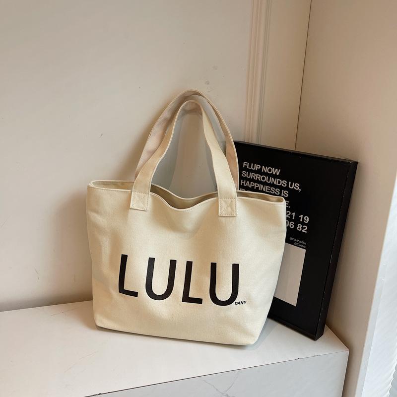 2025 autumn new portable shoulder canvas bag fashionable simple letter trend commuter large capacity shoulder bag