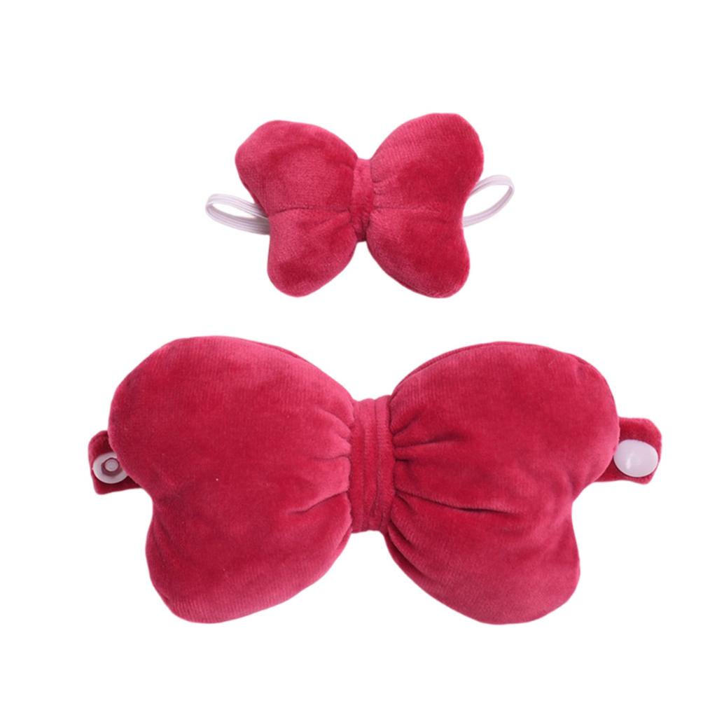 A Pair Of Cute Baby Clothes With Big Bow Accessories