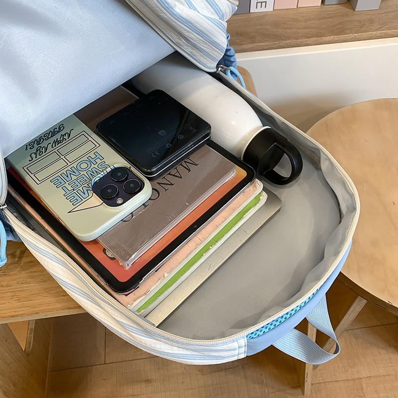 New high-value, fresh and sweet candy-colored striped backpack, high school student large-capacity backpack.