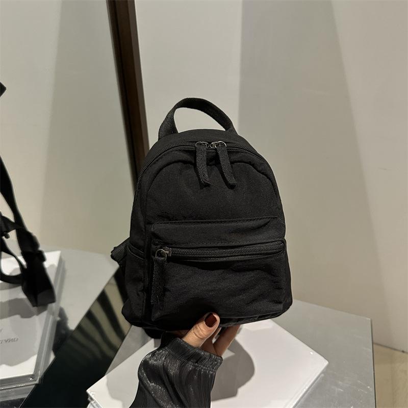 Einfacher lässiger Mini-Rucksack für Damen 2025 neue modische einfarbige kleine Tasche klein frisch Studenten-Reiserucksack