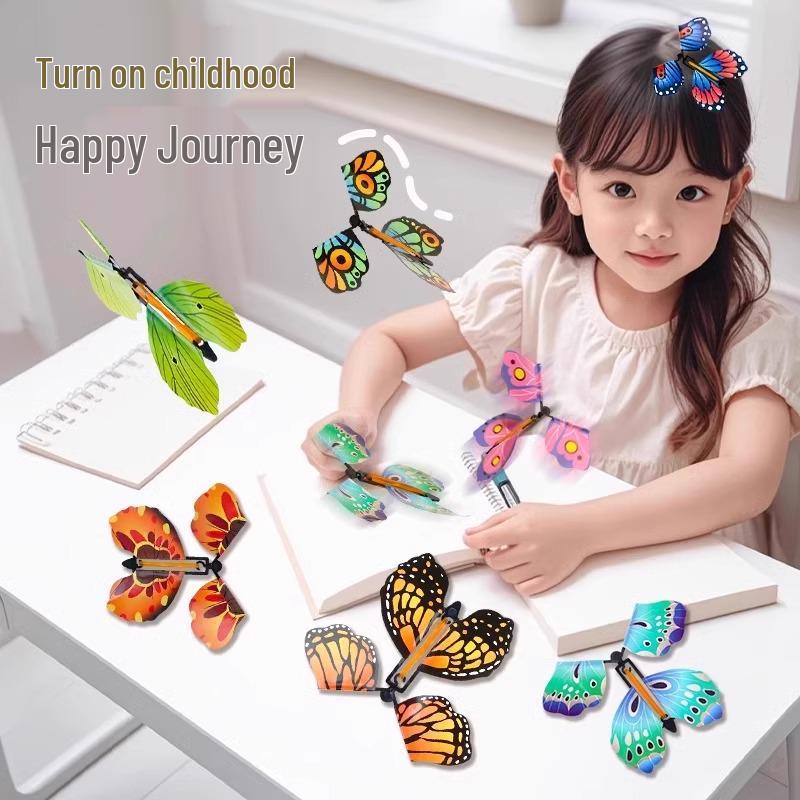 

Children s Outdoor Toy Set: Flying Butterfly, Spraying Flower, Boomerang & Bamboo Dragonfly for Parent-Child Fun.