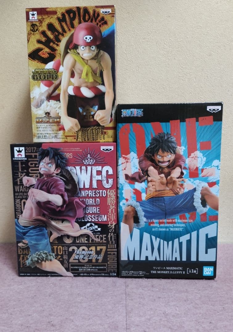 One Piece figure three Luffy figures.