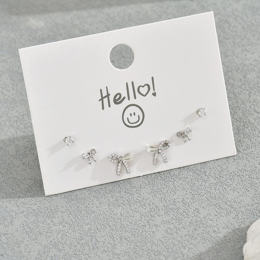 Simple small fresh bow design stud earrings set female personality inlaid zircon earrings