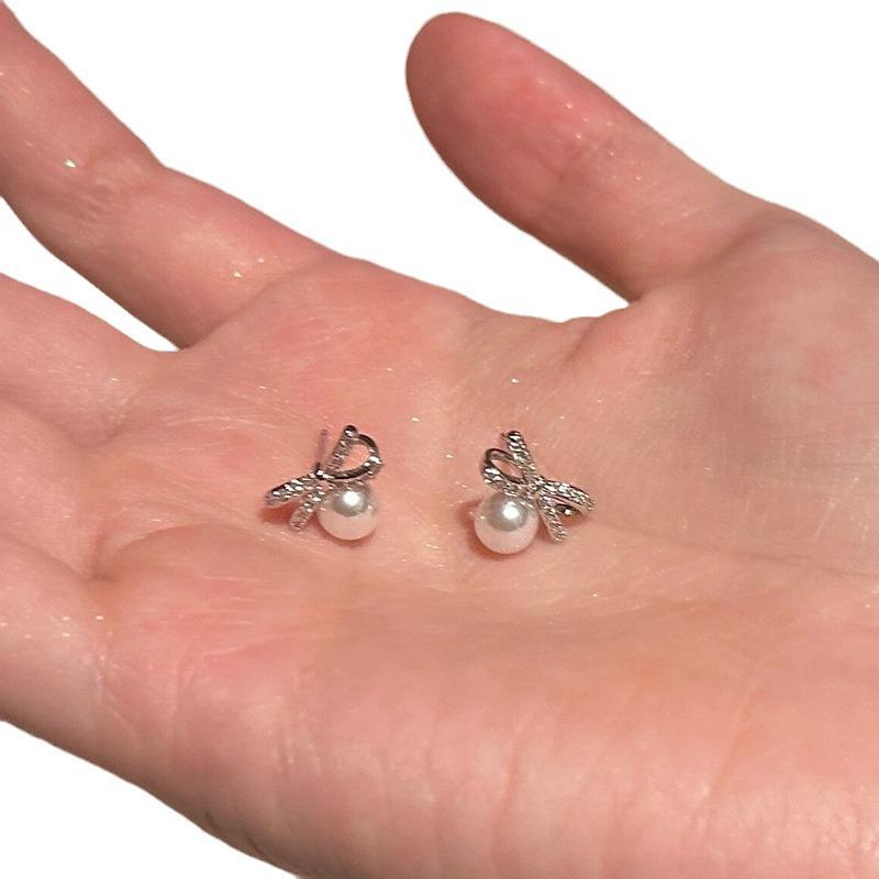 Elegant Zircon Pearl Bow Stud Earrings for Women: Luxurious, Unique, Minimalist, and Versatile.