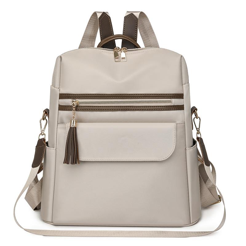 

Женский рюкзак с цветной кисточкой и уличной дорожной сумкой белый