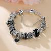 Bracciale con Ciondolo a Forma di Cuore con Strass Neri e Perline Ceramiche di Ciliegio