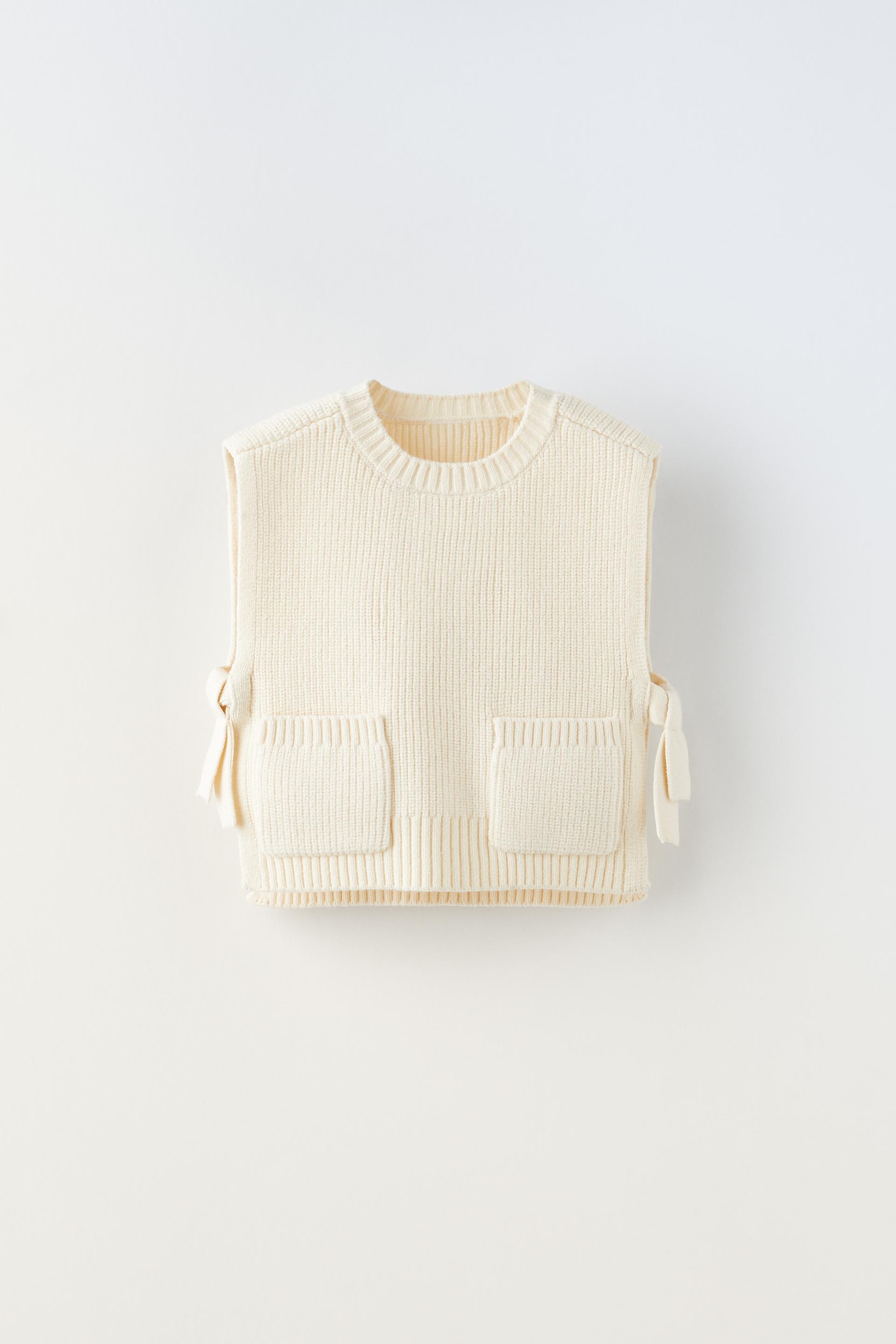 

ВЯЗАННЫЙ ЖИЛЕТ С БАНТАМИ