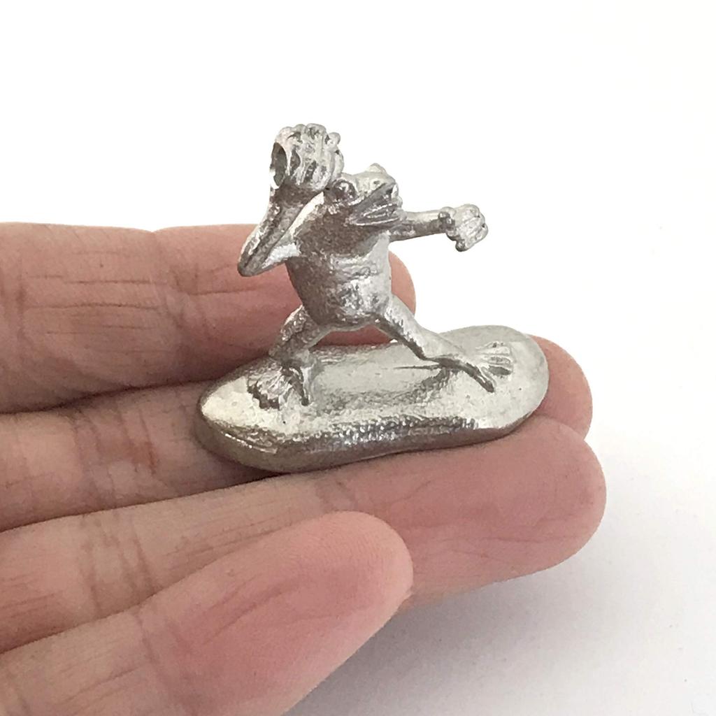 A miniature tin frog from the Choju Jinbutsu Giga perfect for your dry landscape painting, garden.