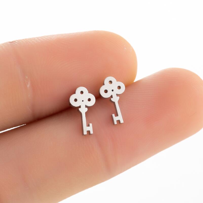 

SMJEL Metal Coraline Key Earrings Stainless Steel Lock Stud Earrings Anime Zircon for Girls Trendy Gifts Cosplay Skeleton Props Copper Clor