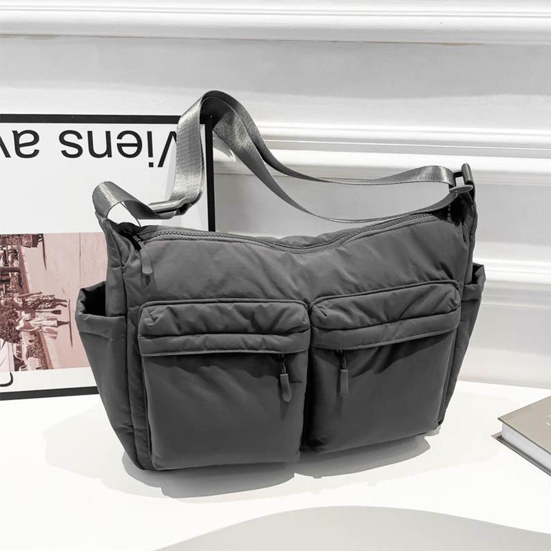 Unisex vodoodpudivá nylonová crossbody taška s více kapsami