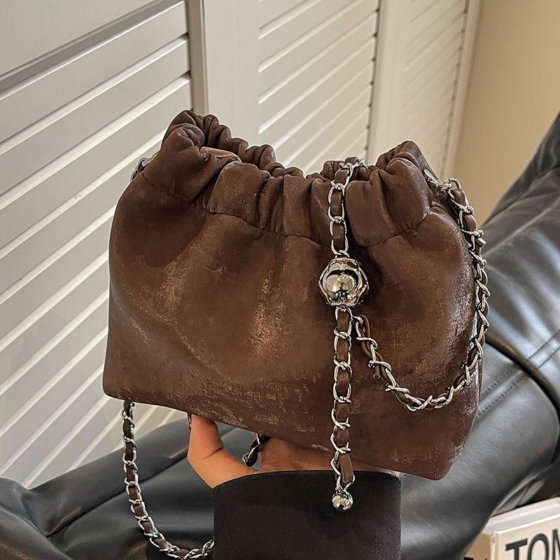 

Bag Korean high-end versatile bucket bag autumn and winter matte retro 2024 new chain shoulder messenger bag women темно-коричневого кольору