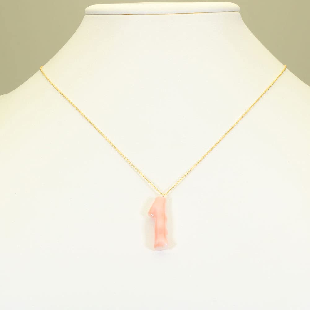 Undyed pink garnet coral branch pendant necklace.
