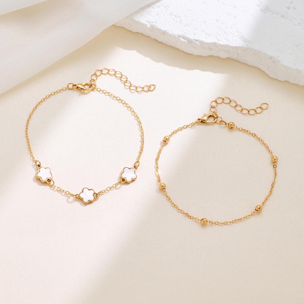 Koreaanse Stijl 4-delige Sieradenset: Bloemenarmband, Ring, Oorbellen met Stud & Klavertje Vier Ketting