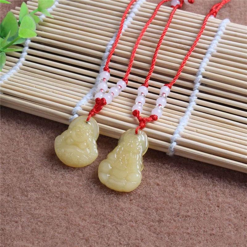 Hetian Jade Guanyin Buddha Pendant Necklace with Red String and Eight Bead Design.