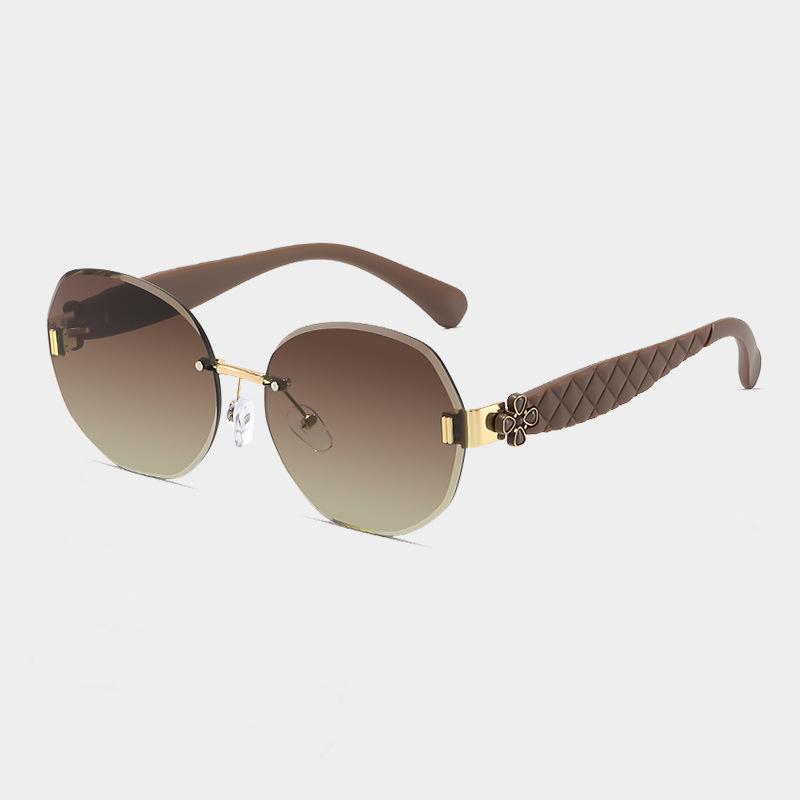Women's Egg-Shaped Stylish Frameless Retro Sunglasses for Summer Photoshoots