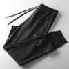 Pantalones de chándal casuales elásticos originales para exportación de productos ganaderos con corte de etiqueta
