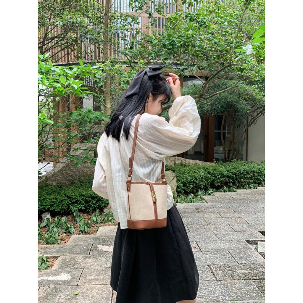 Cowhide canvas splicing bucket bag women's 2025 summer shoulder oblique span bag casual versatile underarm bag Korean version tide