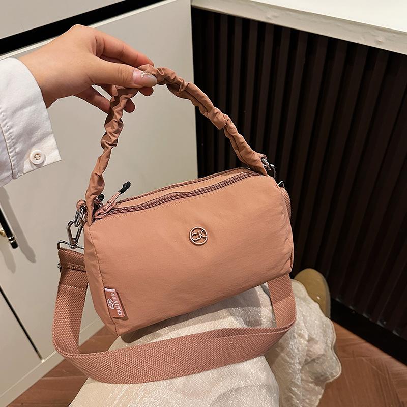 

Summer new foreign style portable cylinder bag women s simple fashion shoulder bag casual light messenger bag nylon bag розовый