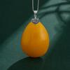 Retro Fu Character Pendant with Jadeite and Amber Safety Clip