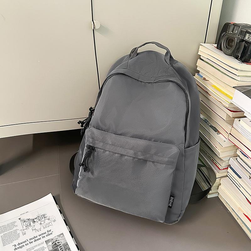 New trendy and cool men's casual backpack, junior high school student class schoolbag, women's large-capacity simple backpack