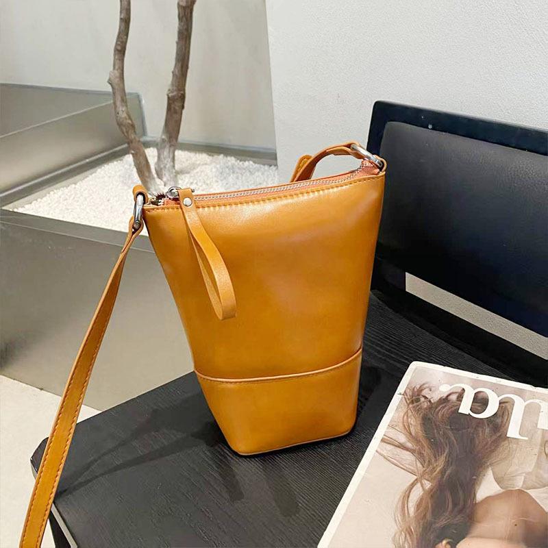 Fashion bucket bag early spring new versatile women's shoulder bag niche design leather women's bag crossbody cosmetic bag