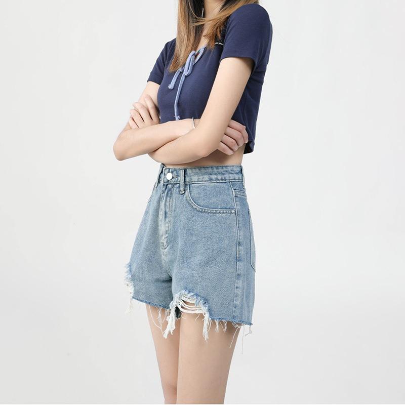 Pantaloncini di jeans casual strappati e versatili da donna alla moda a vita alta da celebrità di Internet con bordo grezzo gamba larga Hot Pants