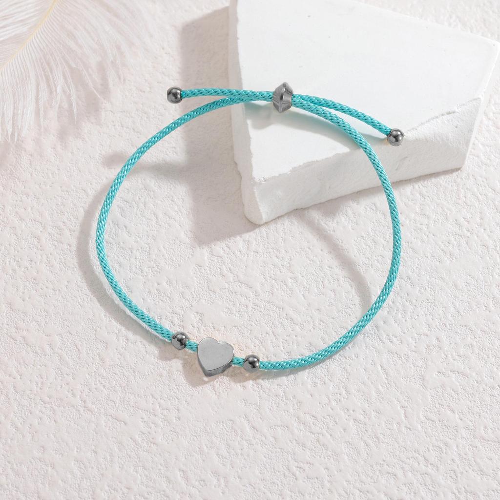Minimalistisches blaues Seilarmband mit Herz-, Männchen- und runden Anhängern aus Edelstahl